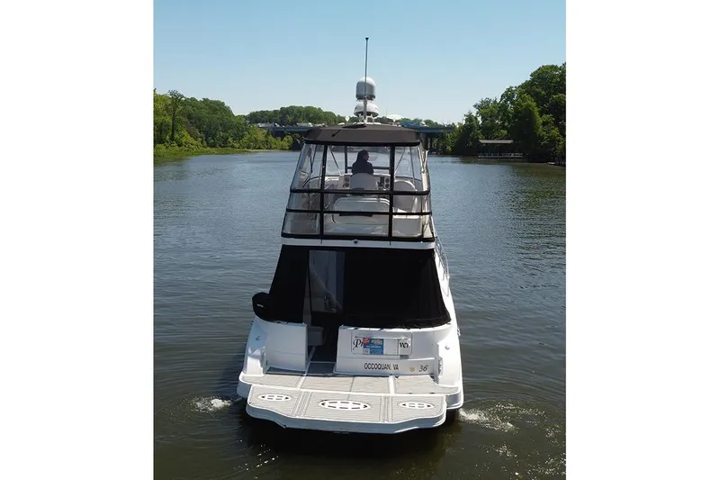 Slide: The Image of 2008 Sea Ray 36 Sedan Bridge cruising on a serene river. - 4