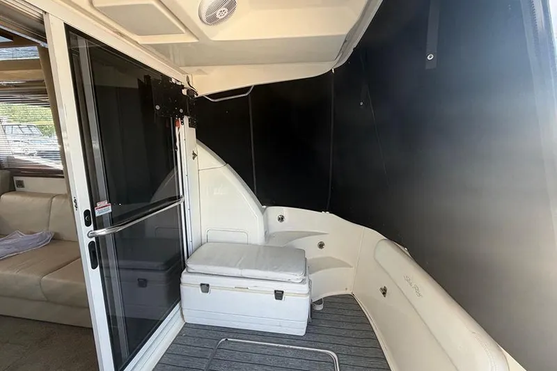 Slide: The Image of 2008 Sea Ray 36 Sedan Bridge interior with seating and storage area. - 6