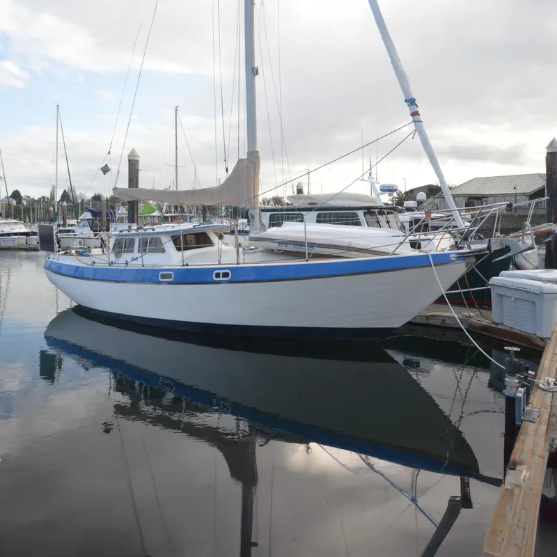 The Image of 1988 Gulf Pilot House sailboat docked in harbor. - 0