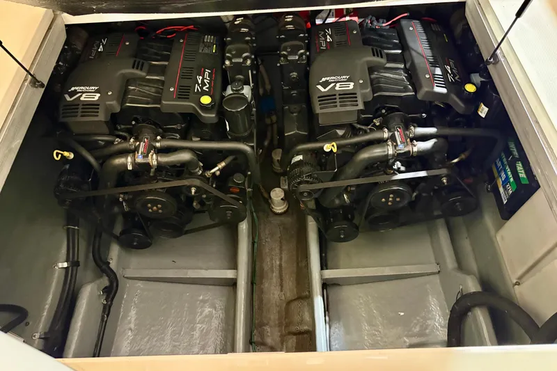 Slide: The Image of Twin Mercury V8 engines in a 2000 Sea Ray 290 Amberjack boat. - 18