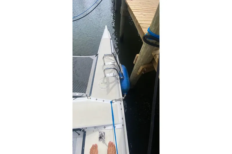 Slide: The Image of Sailboat Corsair F27 (1991) docked, showing bow and deck details. - 17