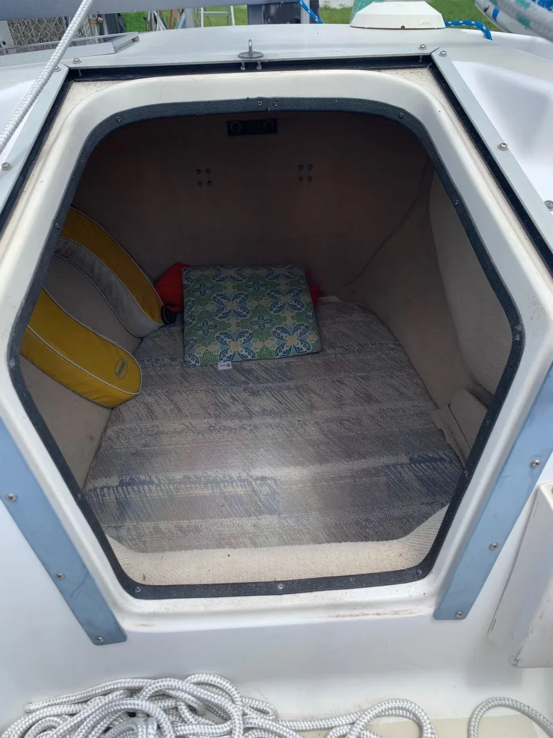 Slide: The Image of Interior of a 1991 Corsair F27 sailboat with cushions and life jackets. - 5