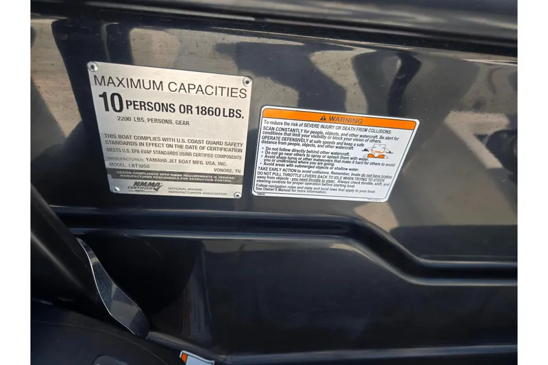 Slide: The Image of 2019 Yamaha Boats SX210 capacity plate, maximum 10 persons or 1860 lbs, safety warnings. - 11