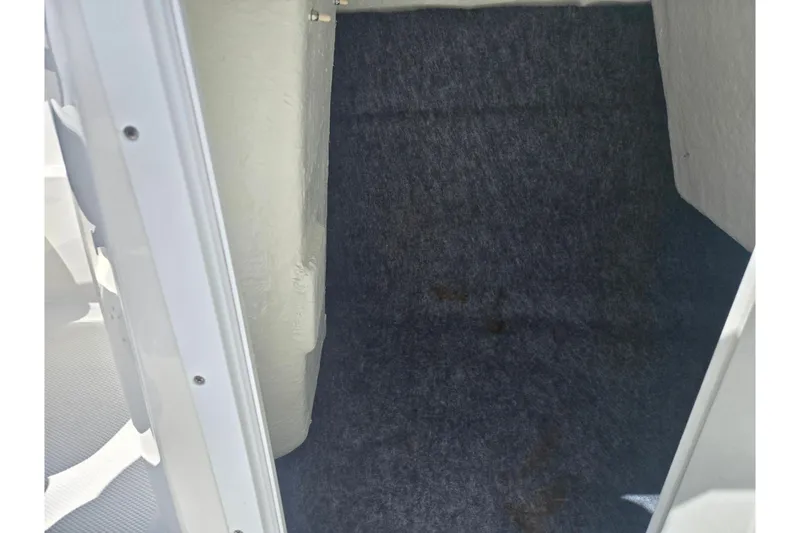 Slide: The Image of Interior storage compartment of a 2019 Yamaha Boats SX210. - 14