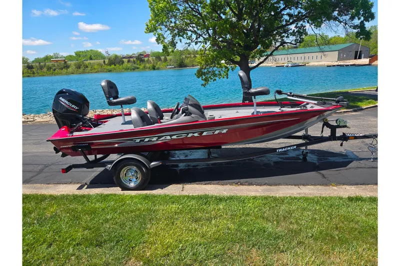 Slide: The Image of 2019 Tracker Pro Team 175 TXW boat on trailer by a scenic lake. - 10
