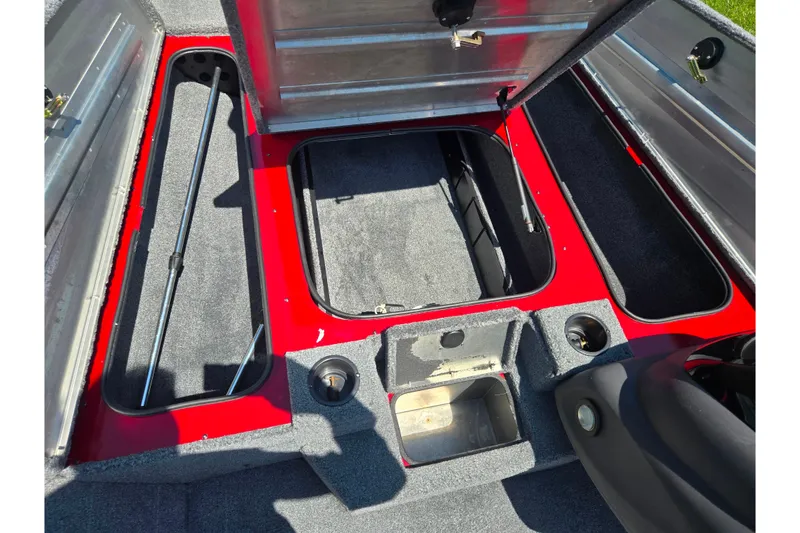 Slide: The Image of 2019 Tracker Pro Team 175 TXW boat interior with open storage compartments. - 15