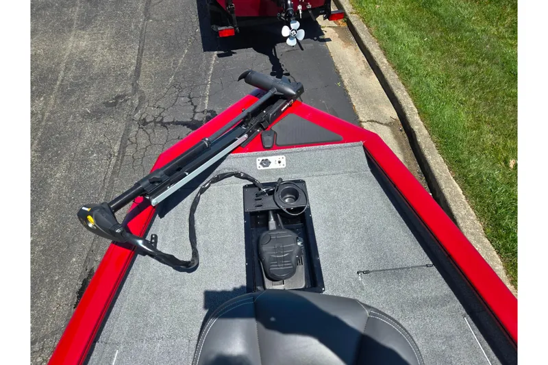 Slide: The Image of 2019 Tracker Pro Team 175 TXW boat with trolling motor on red deck. - 16