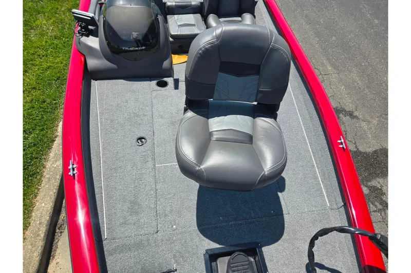Slide: The Image of 2019 Tracker Pro Team 175 TXW boat interior with gray seating and red trim. - 17