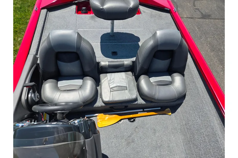 Slide: The Image of 2019 Tracker Pro Team 175 TXW boat interior with gray seats and steering wheel. - 19