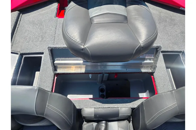 Slide: The Image of 2019 Tracker Pro Team 175 TXW boat interior with storage compartments and seating. - 21
