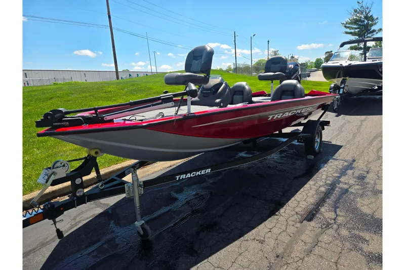 Slide: The Image of 2019 Tracker Pro Team 175 TXW fishing boat on trailer, parked outdoors. - 6