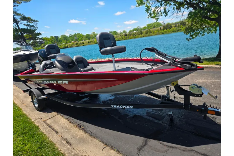 Slide: The Image of 2019 Tracker Pro Team 175 TXW boat on trailer by a scenic lake. - 9