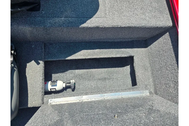 Slide: The Image of Carpeted storage compartment in a 2020 Tracker Pro 160 boat. - 16