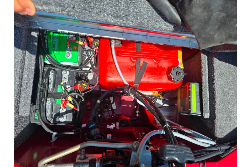 Slide: The Image of 2020 Tracker Pro 160 boat battery and fuel compartment with wiring and components. - 18