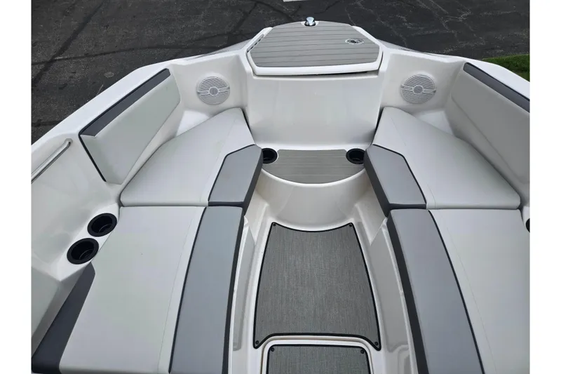 Slide: The Image of 2024 Yamaha Boats AR220 interior with cushioned seating and cup holders. - 15