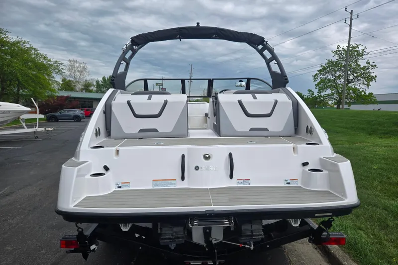 Slide: The Image of 2024 Yamaha Boats AR220, rear view, showcasing sleek design and spacious seating. - 2