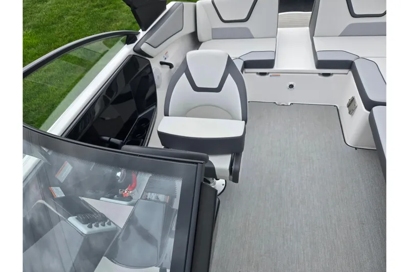 Slide: The Image of 2024 Yamaha Boats AR220 interior with modern seating and sleek dashboard design. - 20