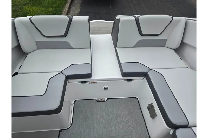 Slide: The Image of 2024 Yamaha Boats AR220 interior seating with modern gray upholstery design. - 22