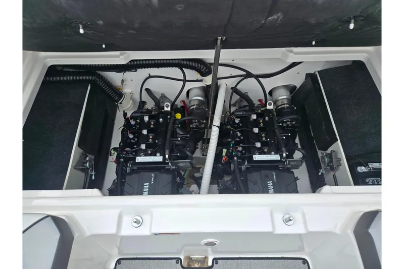 Slide: The Image of 2024 Yamaha Boats AR220 engine compartment showcasing dual engines and components. - 23