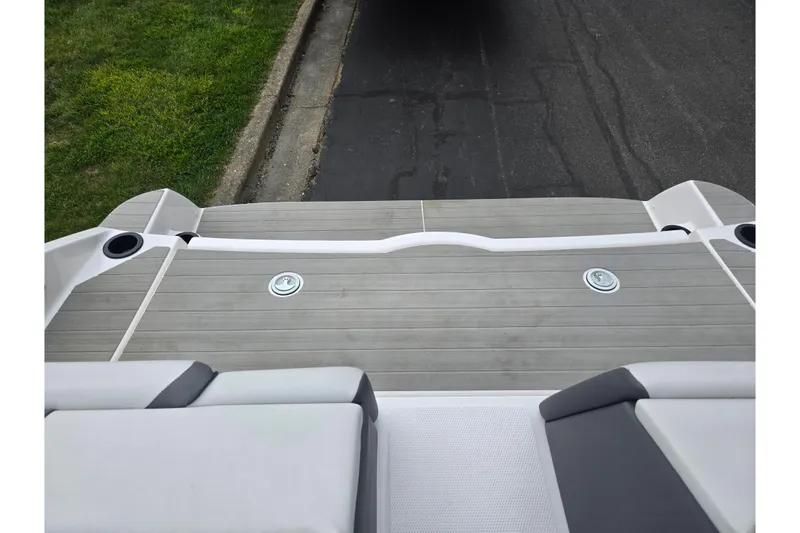 Slide: The Image of 2024 Yamaha Boats AR220 swim platform with sleek design and integrated cup holders. - 24