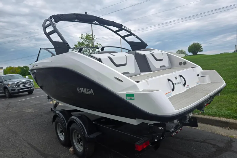 Slide: The Image of 2024 Yamaha Boats AR220 on trailer, sleek design, parked outdoors. - 3