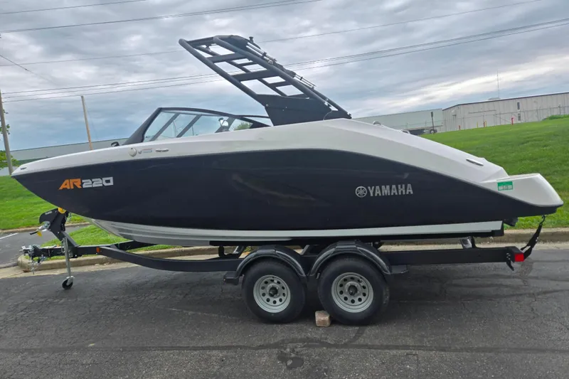 Slide: The Image of 2024 Yamaha Boats AR220 on trailer, sleek design, parked outdoors. - 4