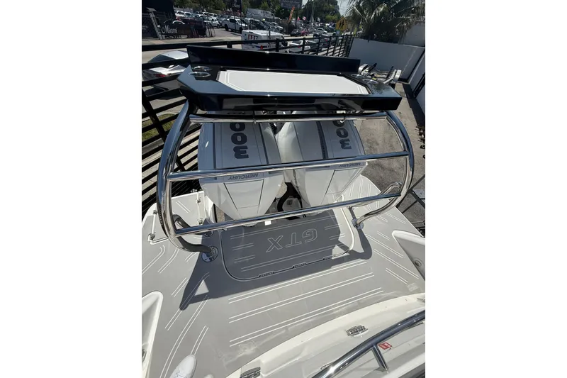 Slide: The Image of 2026 Granfort 300 GTX boat with dual Mercury engines, sleek design, and modern features. - 14