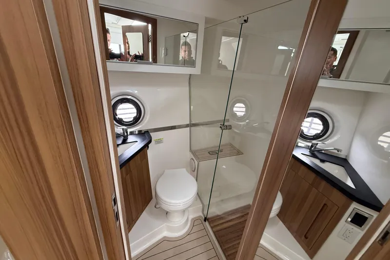 Slide: The Image of Luxurious bathroom interior of 2026 Granfort 300 GTX yacht with modern fixtures and wood accents. - 5