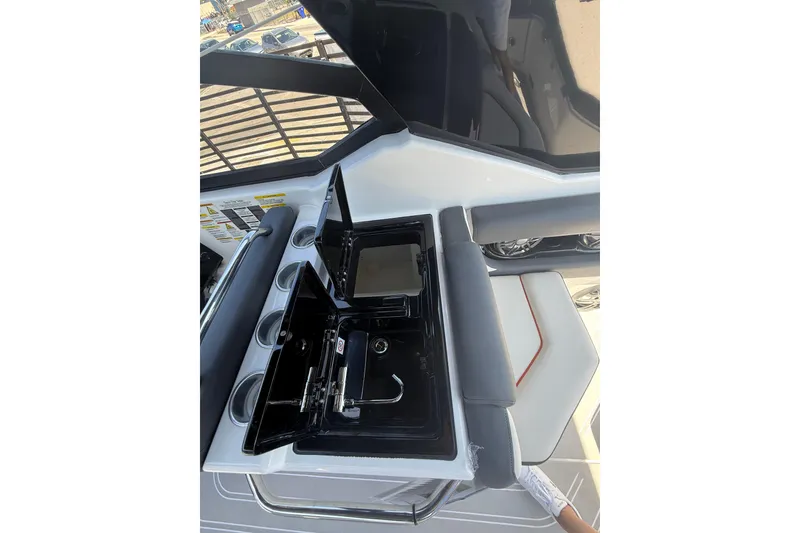 Slide: The Image of 2026 Granfort 300 GTX boat interior with sleek seating and built-in cup holders. - 9