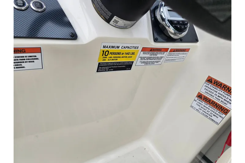 Slide: The Image of Control panel of 2022 Lexington 621TT Extreme with capacity and warning labels. - 13