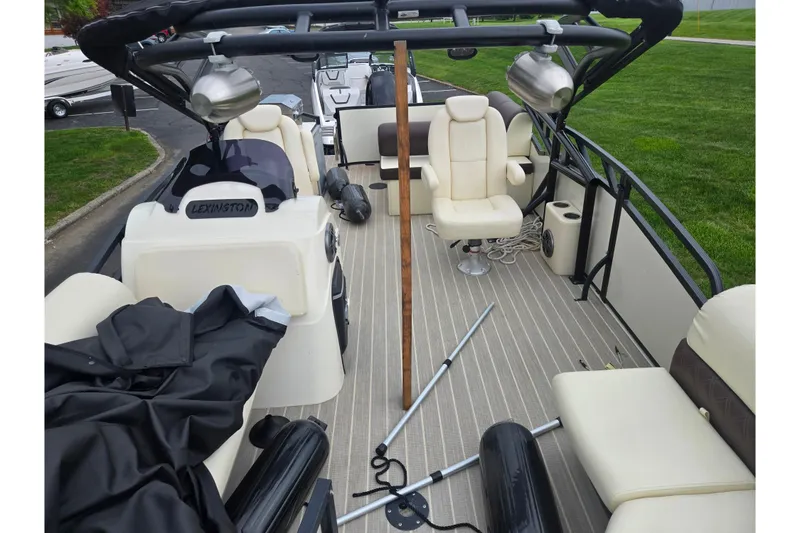 Slide: The Image of 2022 Lexington 621TT Extreme pontoon boat interior with seating and equipment on deck. - 17