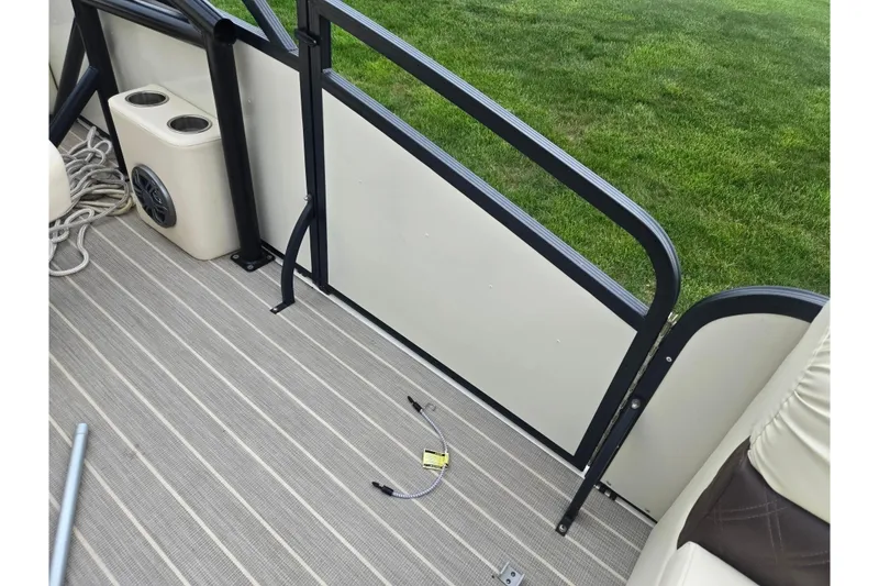 Slide: The Image of Interior of 2022 Lexington 621TT Extreme boat with striped flooring and cup holders. - 19