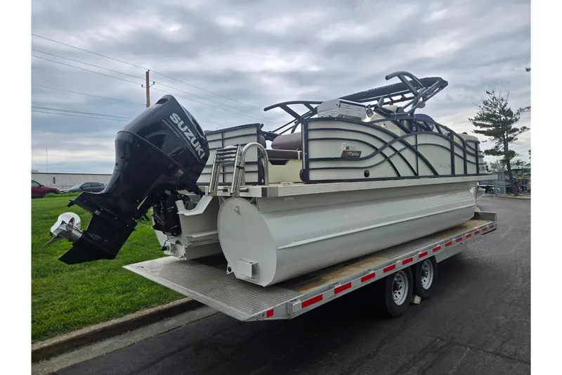 Slide: The Image of 2022 Lexington 621TT Extreme pontoon boat on trailer with Suzuki outboard motor. - 3