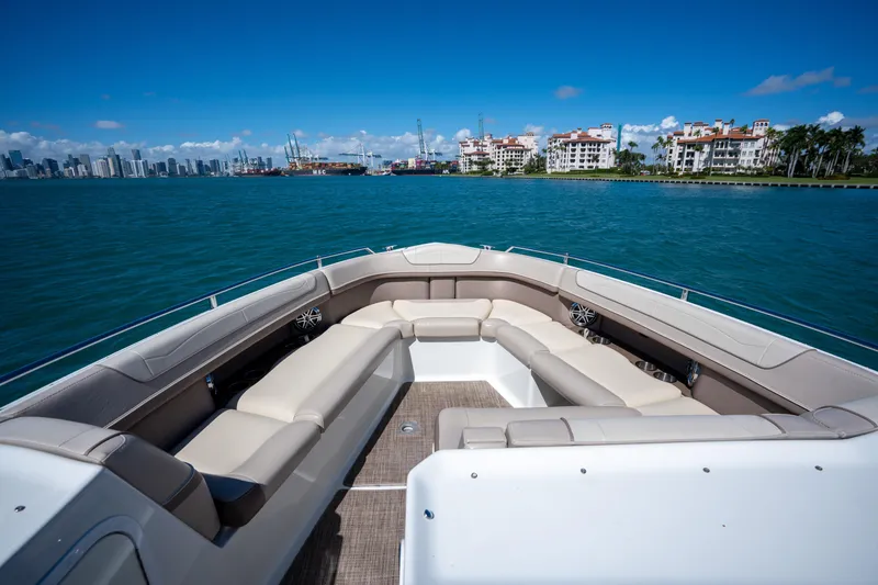 Slide: The Image of 2018 Formula 350 Crossover Bowrider OB on water, city skyline in background. - 24