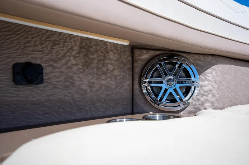 Slide: The Image of 2018 Formula 350 Crossover Bowrider OB interior with JL Audio speaker and cup holder. - 32