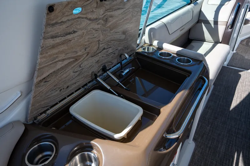 Slide: The Image of 2018 Formula 350 Crossover Bowrider OB interior with sink and cup holders. - 33