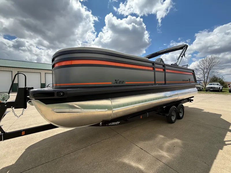 Slide: The Image of Viaggio Lago X-U 22 pontoon boat 2026 on trailer under cloudy sky. - 3