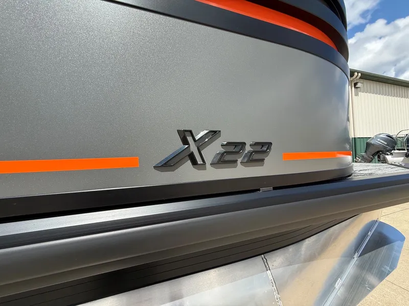 Slide: The Image of Viaggio Lago X-U 22 boat, 2026 model, with orange stripes. - 6