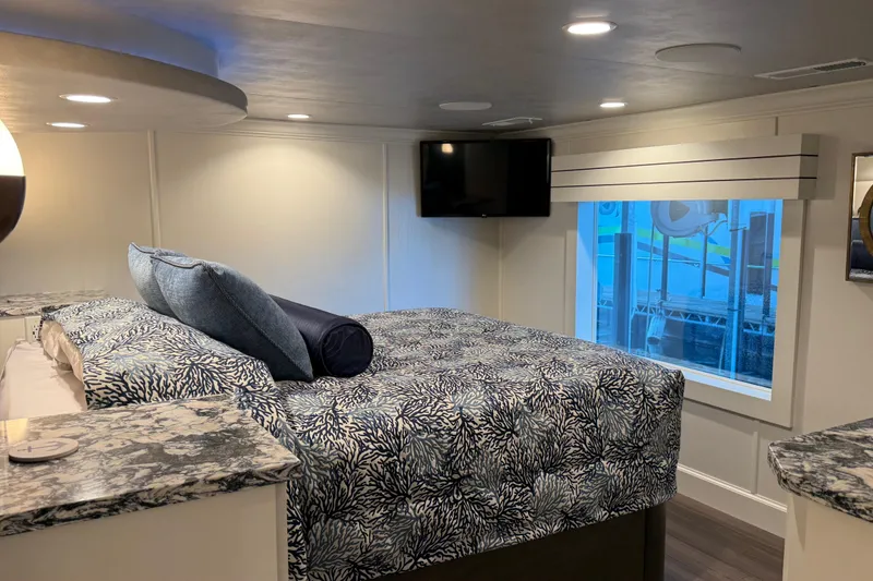 Slide: The Image of Luxurious Thoroughbred 20 x 102 RV interior with elegant bedding and modern amenities, 2020 model. - 24