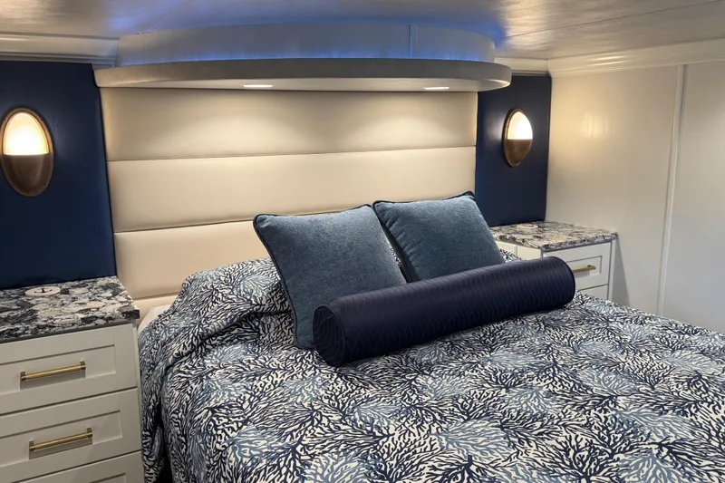 Slide: The Image of Luxurious bedroom interior in a 2020 Thoroughbred 20 x 102, featuring elegant blue and white decor. - 26