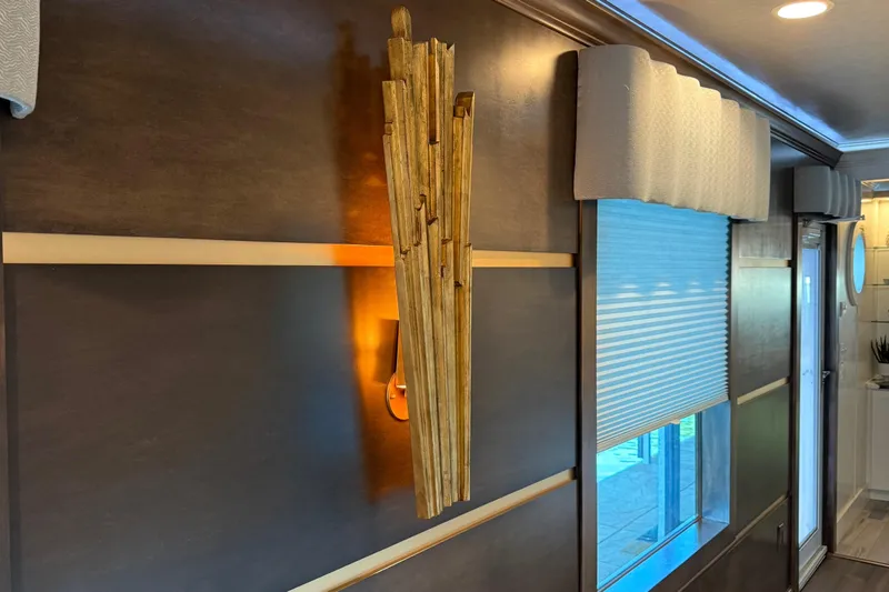 Slide: The Image of Modern interior of 2020 Thoroughbred 20 x 102 RV with stylish wall light fixture. - 30