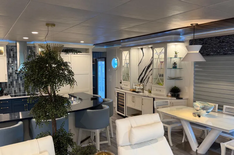 Slide: The Image of Luxurious 2020 Thoroughbred 20 x 102 houseboat interior with modern kitchen and dining area. - 34