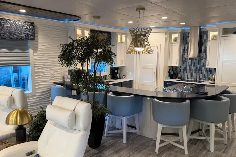 Slide: The Image of Luxurious Thoroughbred 20 x 102 houseboat interior with modern kitchen and stylish seating, 2020 model. - 36