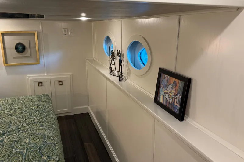 Slide: The Image of Modern interior of Thoroughbred 20 x 102 houseboat, featuring art and porthole windows, 2020 model. - 37