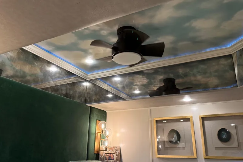 Slide: The Image of Luxurious room with cloud ceiling, modern fan, and elegant lighting in a Thoroughbred 20 x 102. - 40