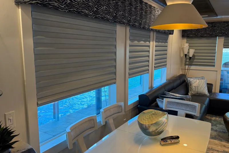 Slide: The Image of Modern living room with gray blinds, leather sofa, and stylish decor in a Thoroughbred 20 x 102 houseboat. - 43