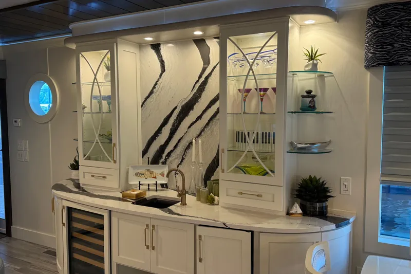 Slide: The Image of Luxurious modern bar area with elegant cabinetry and marble countertop, Thoroughbred 20 x 102, 2020. - 45