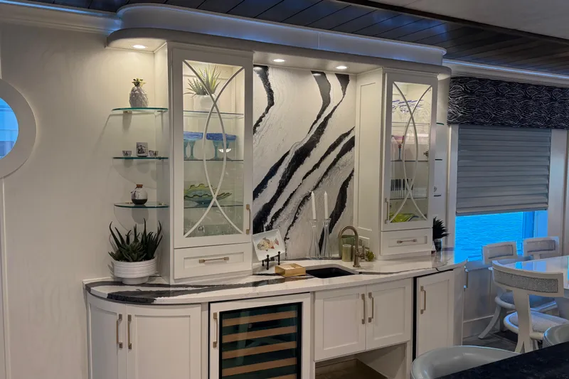 Slide: The Image of Luxurious kitchen interior in a 2020 Thoroughbred 20 x 102, featuring elegant cabinetry and decor. - 52