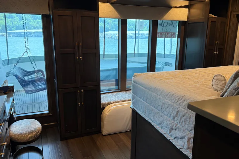 Slide: The Image of Luxurious 2020 Thoroughbred 20 x 102 houseboat bedroom with lake view and elegant furnishings. - 7