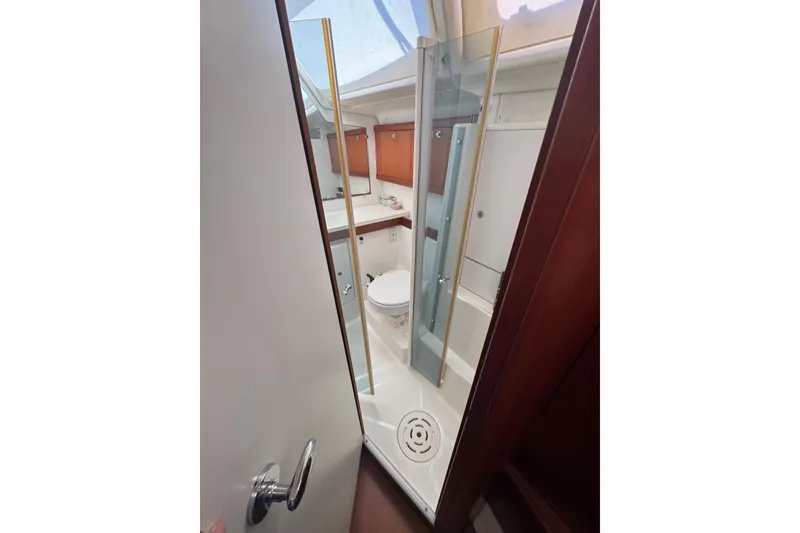 Slide: The Image of Bathroom interior of 2007 Beneteau Oceanis 49 yacht, featuring shower and toilet. - 13